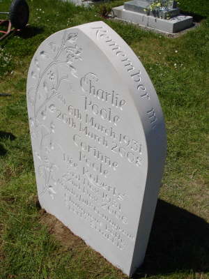 Headstone with lettering on curved edge